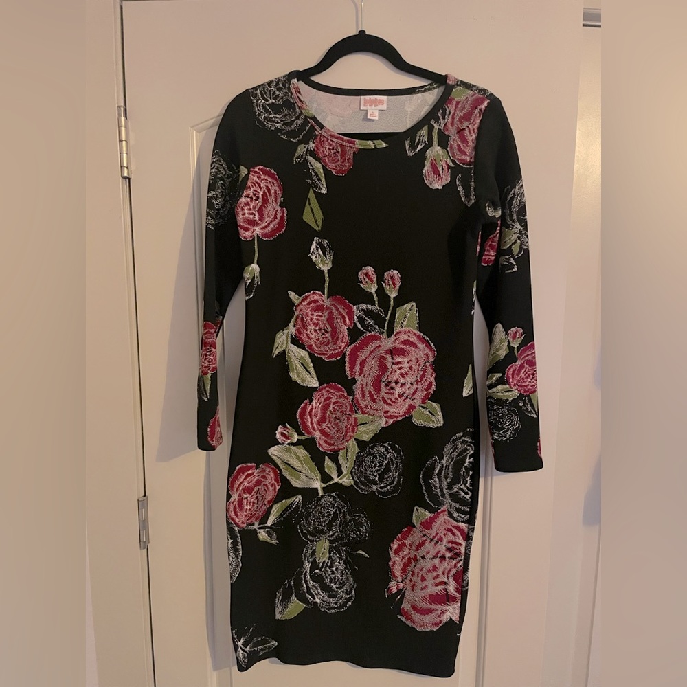 Long sleeve form fitting, knee length dress